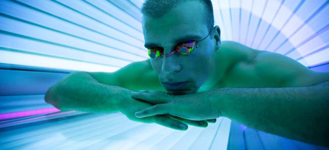 Man in tanning bed